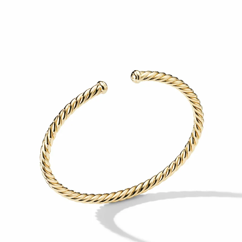 Vintage bangles with intricate filigree metalwork -David Yurman  Bracelet in 18-Karat Yellow Gold