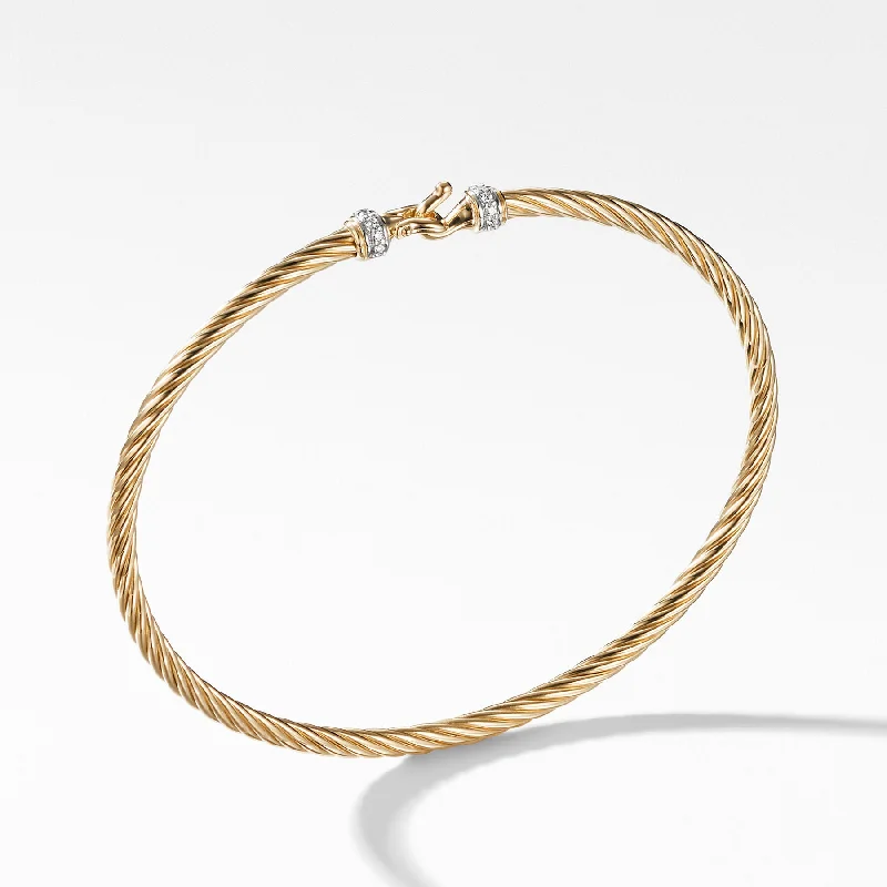 Silver bangles featuring vibrant turquoise stone inlays -David Yurman  Bracelet in 18-Karat Yellow Gold