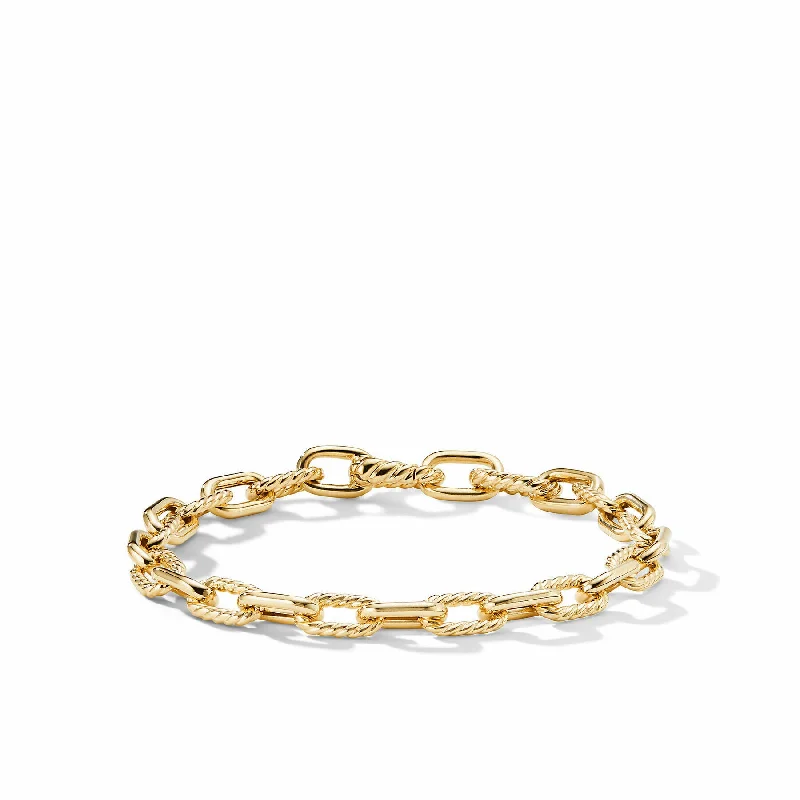 Silver bangles with polished mirror finish shine -David Yurman The Madison® Collection Bracelet in 18-Karat Yellow Gold