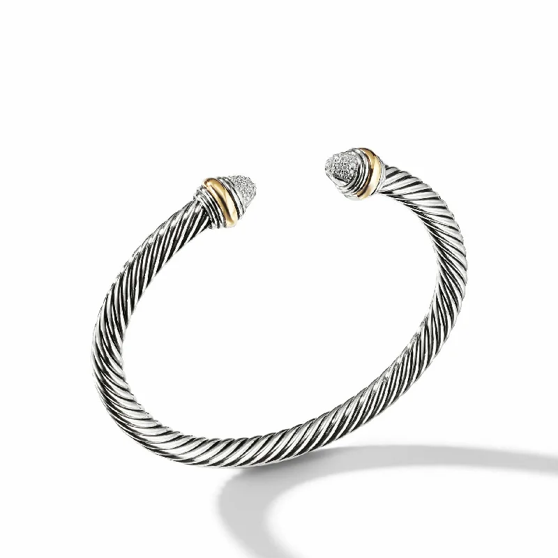 Thin bangles perfect for layering multiple styles -David Yurman The Cable Collection® Bracelet in Silver and 14-Karat Yellow Gold